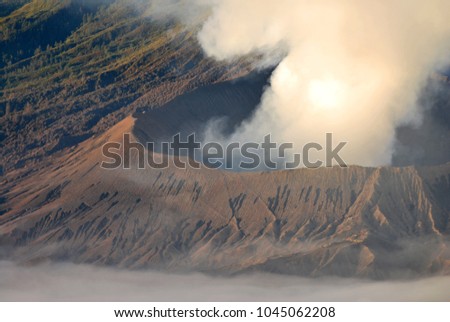 Edge of the volcano at Mount Bromo is an active volcano and part of the Tengger massif, in East Java, Indonesia.The volcano belongs to the Bromo Tengger Semeru National Park. Brown nature background