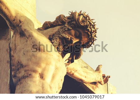 Jesus Christ in a crown of thorns, crucifixion. The concept of faith in God Royalty-Free Stock Photo #1045079017