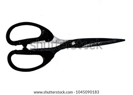 Close up of an sharp scissor isolated on a white surface.