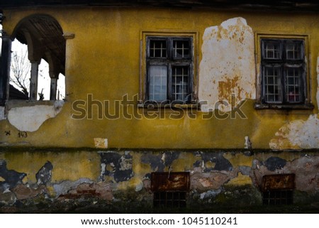 An old yellow house with windows