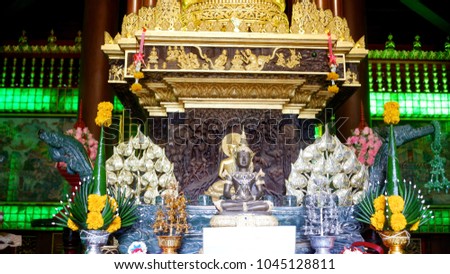 Buddha in the middle, The flower side by Thai traditional style.