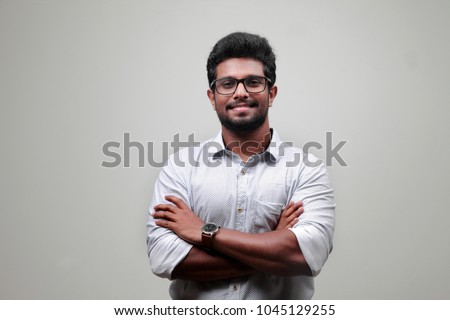 Portrait of a young man of Indian origin Royalty-Free Stock Photo #1045129255