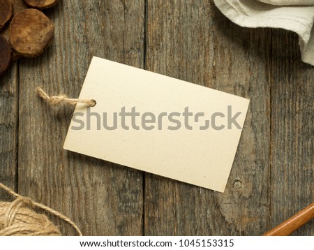Paper notes on rope on wooden background. Copy space.