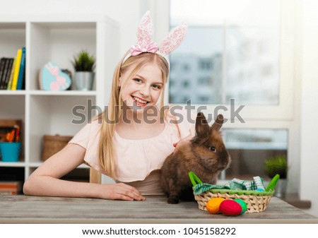 Teenage girl holding Easter eggs