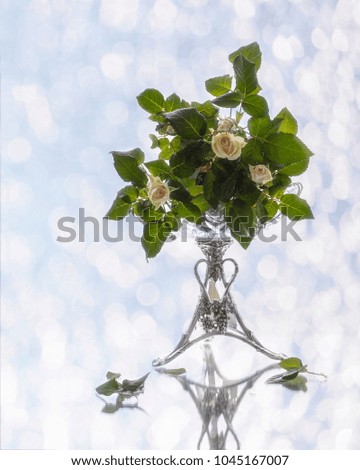 Bouquet of the white roses on the mirror table