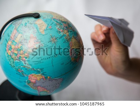 The world and a paper plane