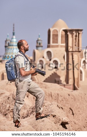 The tourist inspects the old district of Kashan city in Iran during an independent individual trip.