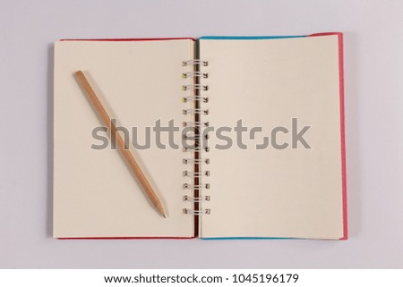 notebook with brown pencil, office concept top view