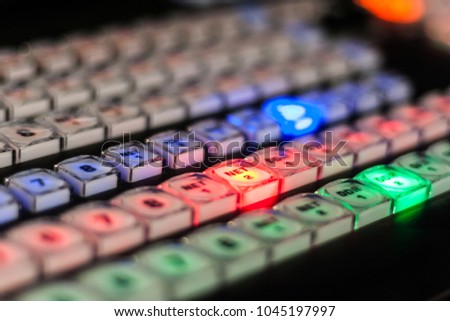 Video mixer with colored buttons with light. Red, green and blue buttons. multiple rows of on / off buttons. Focus on Net 2.