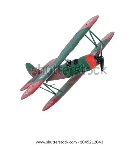 Green airplane assembled painted by child isolated on the white background