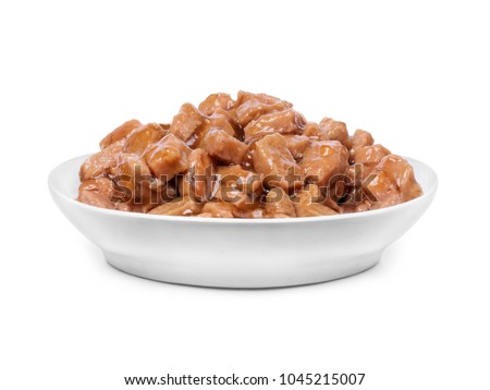 Wet food for dogs and cats in a bowl close up Royalty-Free Stock Photo #1045215007