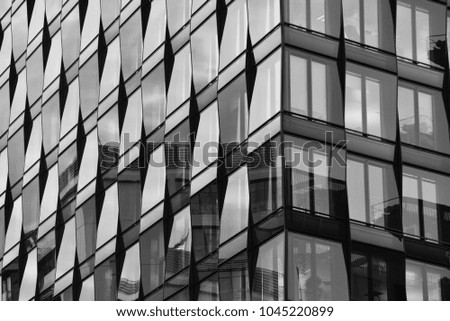 Part of a modern building with reflective windows