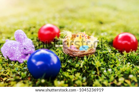 Easter holiday. Colorful Easter eggs in a grass. Easter concept