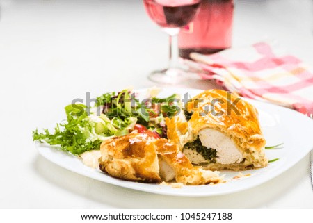 chicken breast stuffed spinach in puff pastry with lettuce mix