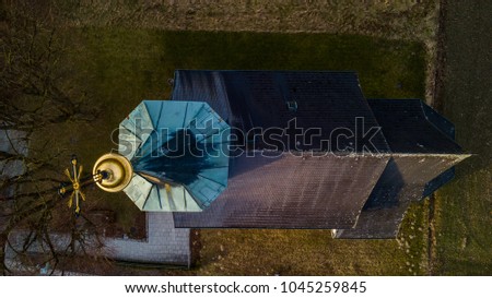 church frame above, drone shot of a church while sunset, drone photography, close up drone shot of a church in Austria
