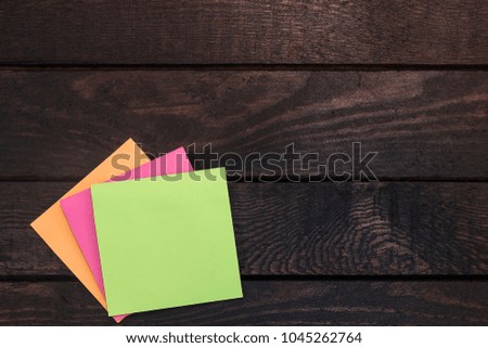 High angle photo of reminder stickers on wood