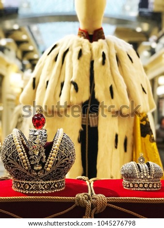 Large and small Crowns of the Russian Empire against the background of an ermine mantle/ From Russia with love Royalty-Free Stock Photo #1045276798