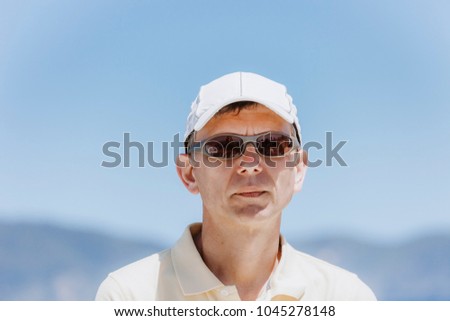 Portrait of man with sunglasses against sky - Bay of Islands, New Zealand