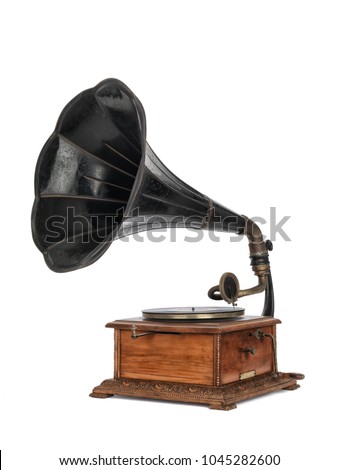 Antique French gramophone (1912) with black gold striped horn, isolated on white background.