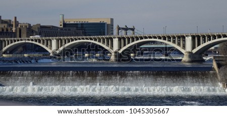 Mississippi River Lock and Third Avenue Bridge on hazy winter day.                          