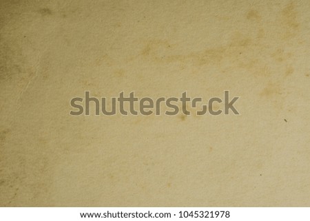 Vintage and antique background frame art concept. Front view of blank old aged dirty photo paper texture with stains and scratches. Detailed closeup studio shot.