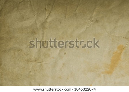 Vintage and antique background frame art concept. Front view of blank old aged dirty photo paper texture with stains and scratches. Detailed closeup studio shot.