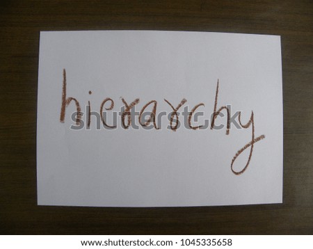 Text hierarchy hand written by brown oil pastel on white color paper