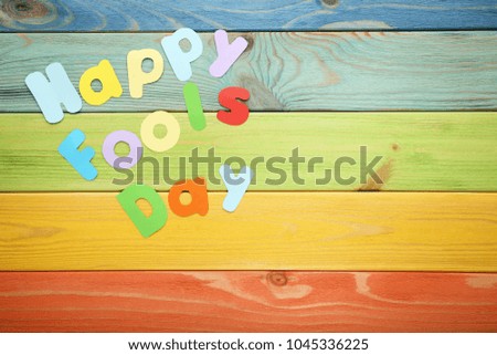 Inscription Happy Fools Day on wooden table
