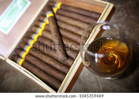 Large box of Cuban cigars on a wooden table in a presentable package