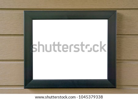 blank picture frame on wood wall