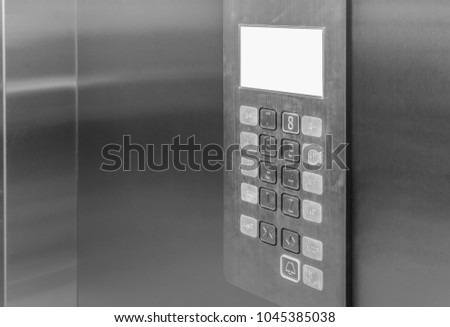 Elevator interior control panel with Braille dots buttons lift accessible to the blind