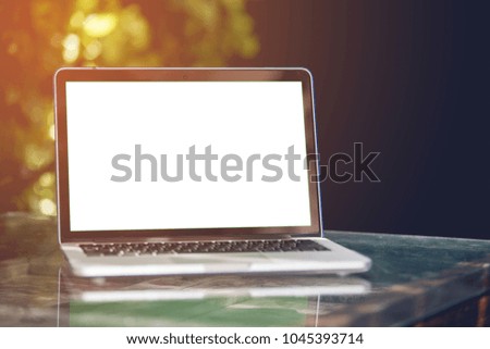 Mockup image of laptop with blank white screen.