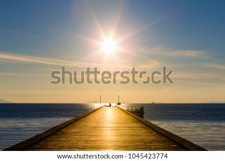 Wooden bridge to the sea at sunset beach in island Koh Samui, Thailand. Vacation and holiday concept