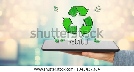 Recycle with man holding a tablet computer