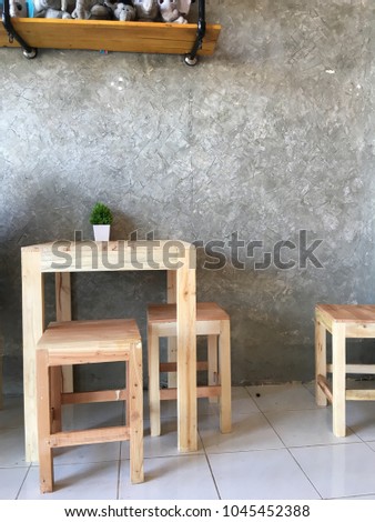 wood table on blur of cafe, coffee shop, bar, wall building background - can used for display or montage your products Royalty-Free Stock Photo #1045452388