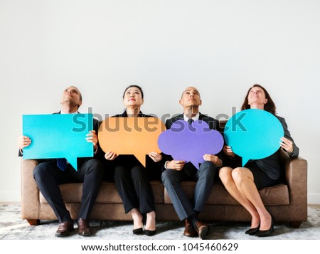 Business people sitting together with icons