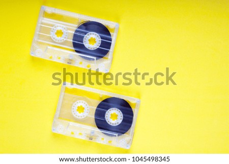 A compact cassettes on a colored table. View from above. 