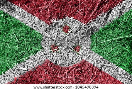 Burundi flag on dry grass texture