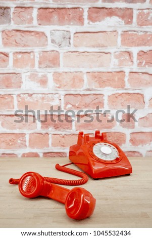 A studio photo of a rotary telephone