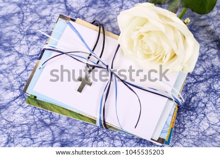 Letters with white rose and necklace with crucifix