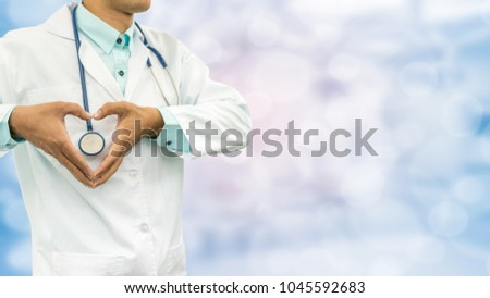 Male Doctor Making Heart Sign By Hands In The Hospital Or Office. Concept Of Heart Care, Medical Technology.