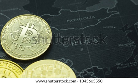 The Gold coin Bitcoin on dark map concept image picture for Background.

