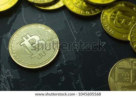 The Gold coin Bitcoin on dark map concept image picture for Background.

