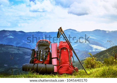 Hiking in the mountains in the summer with a backpack.  Royalty-Free Stock Photo #1045640170