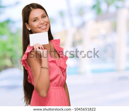 Happy Young Woman Holding Blank Placard, outdoor
