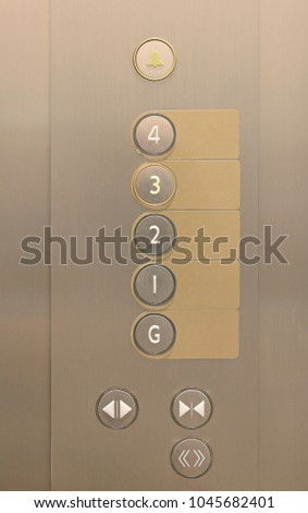Elevator buttons on panel with blank label.