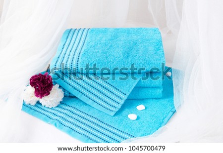 Bath towels with white curtain background