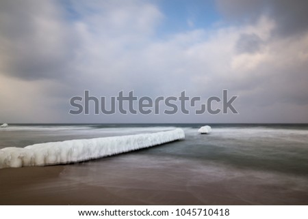 Frozen breakwaters on the popular beach in Chalupy village near Hel, Poland