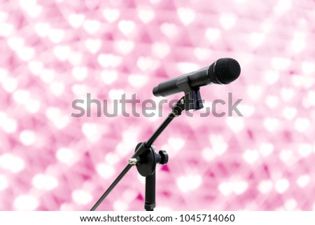 Microphone close up shot on blur heart Bokeh Pink background beautiful romantic or glitter lights heart soft, Karaoke Microphone, Microphone singing love concept, Microphones orator and conference