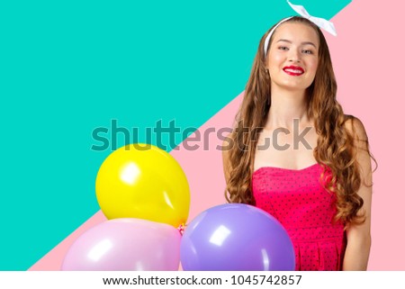 Portrait of joyful woman with balloons